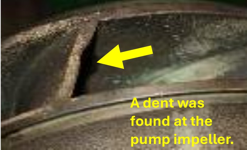 Pump impeller with a dent marked by an arrow, found after the unbalance alert